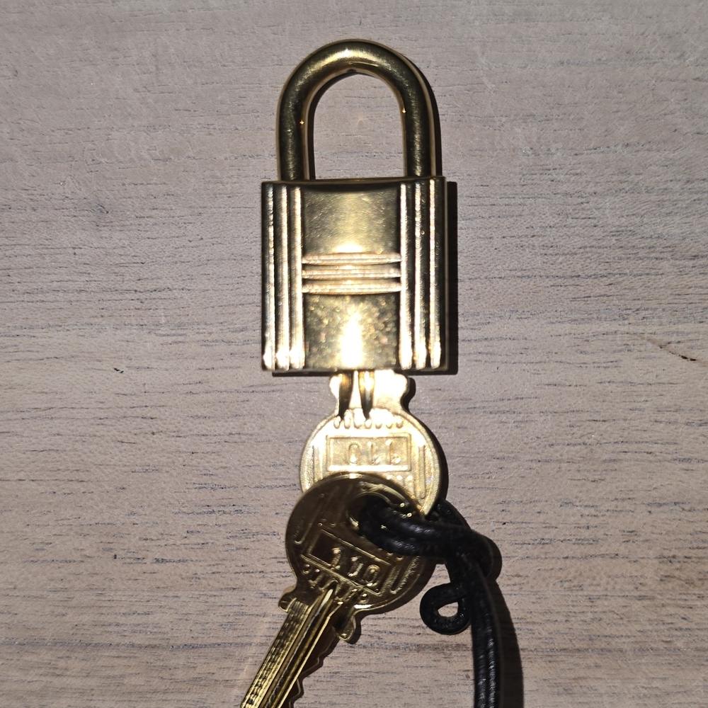 HERMES GOLD LOCK USED STAMPED  one lock and two keys #110 Authentic